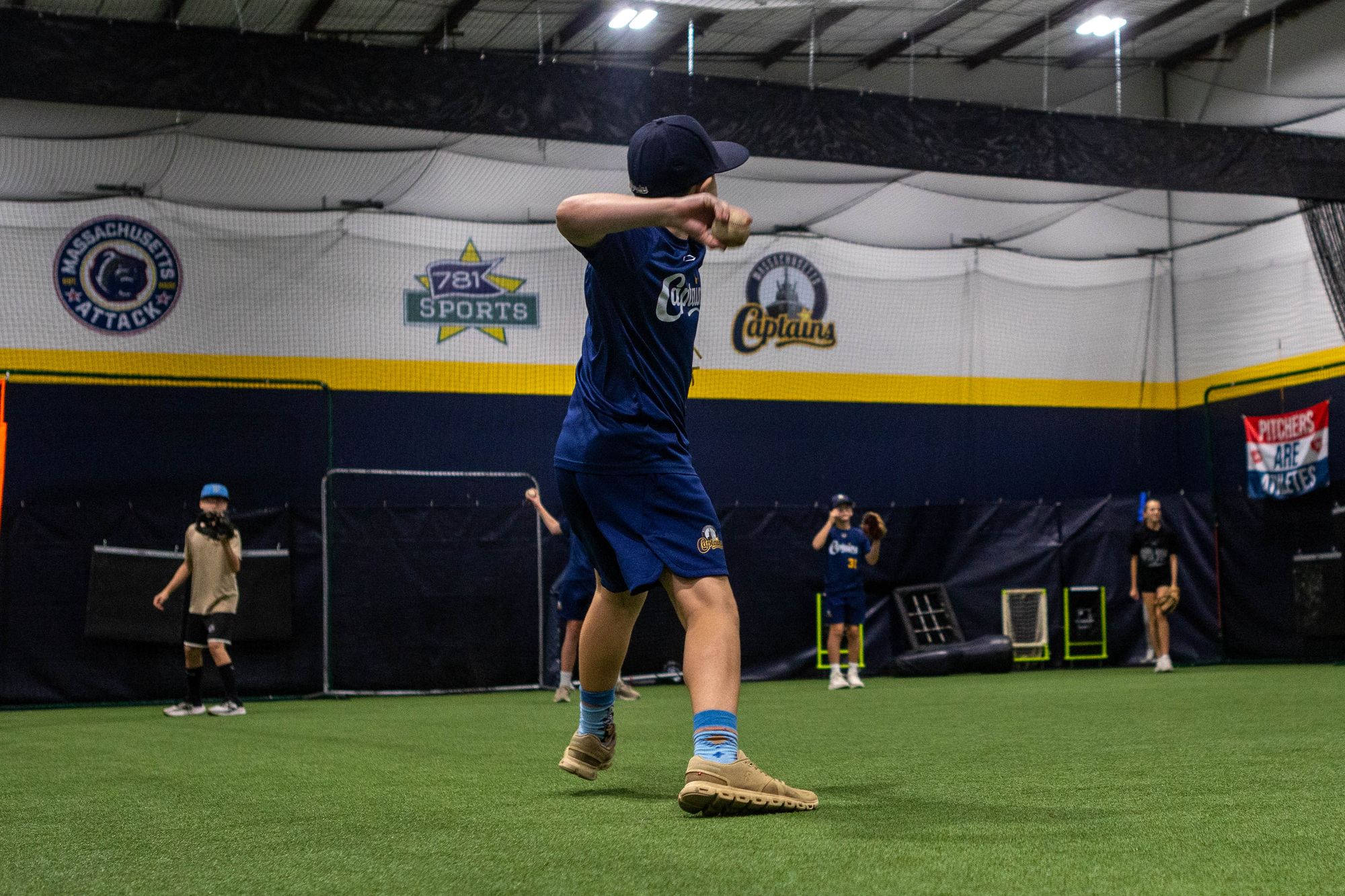 A Mass Captains player throwing on the open turf at 781 Sports Performance